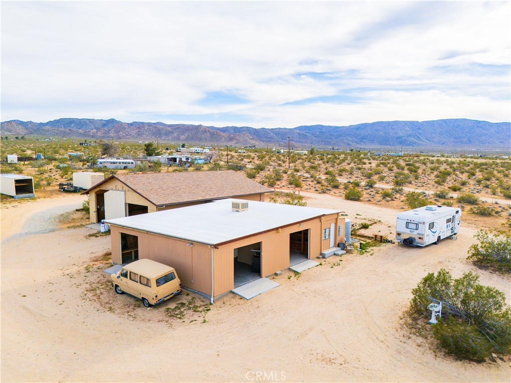 5975 Desert Star Road Johnson Valley, CA 92285 - Photo 59 of 74 an aerial view of a house with a yard and city view