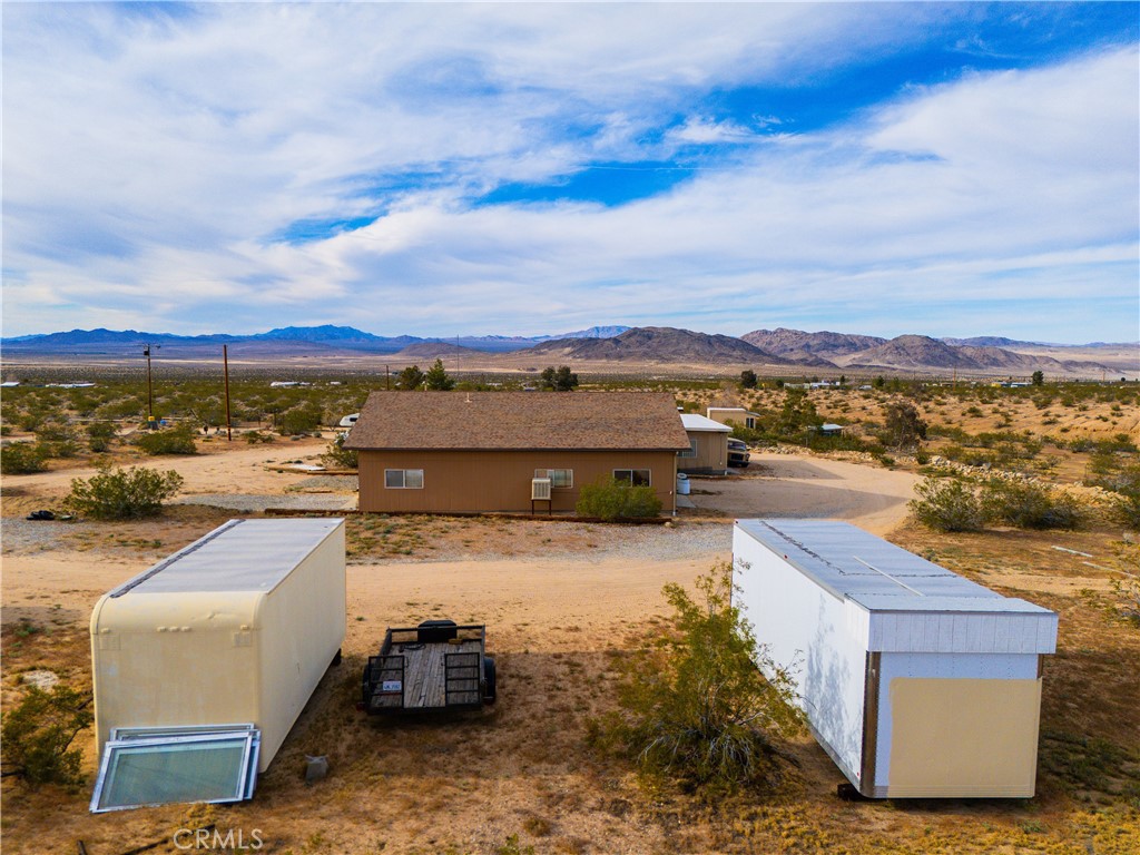 5975 Desert Star Road Johnson Valley, CA 92285 - Photo 62 of 74 a view of a terrace with lawn chairs