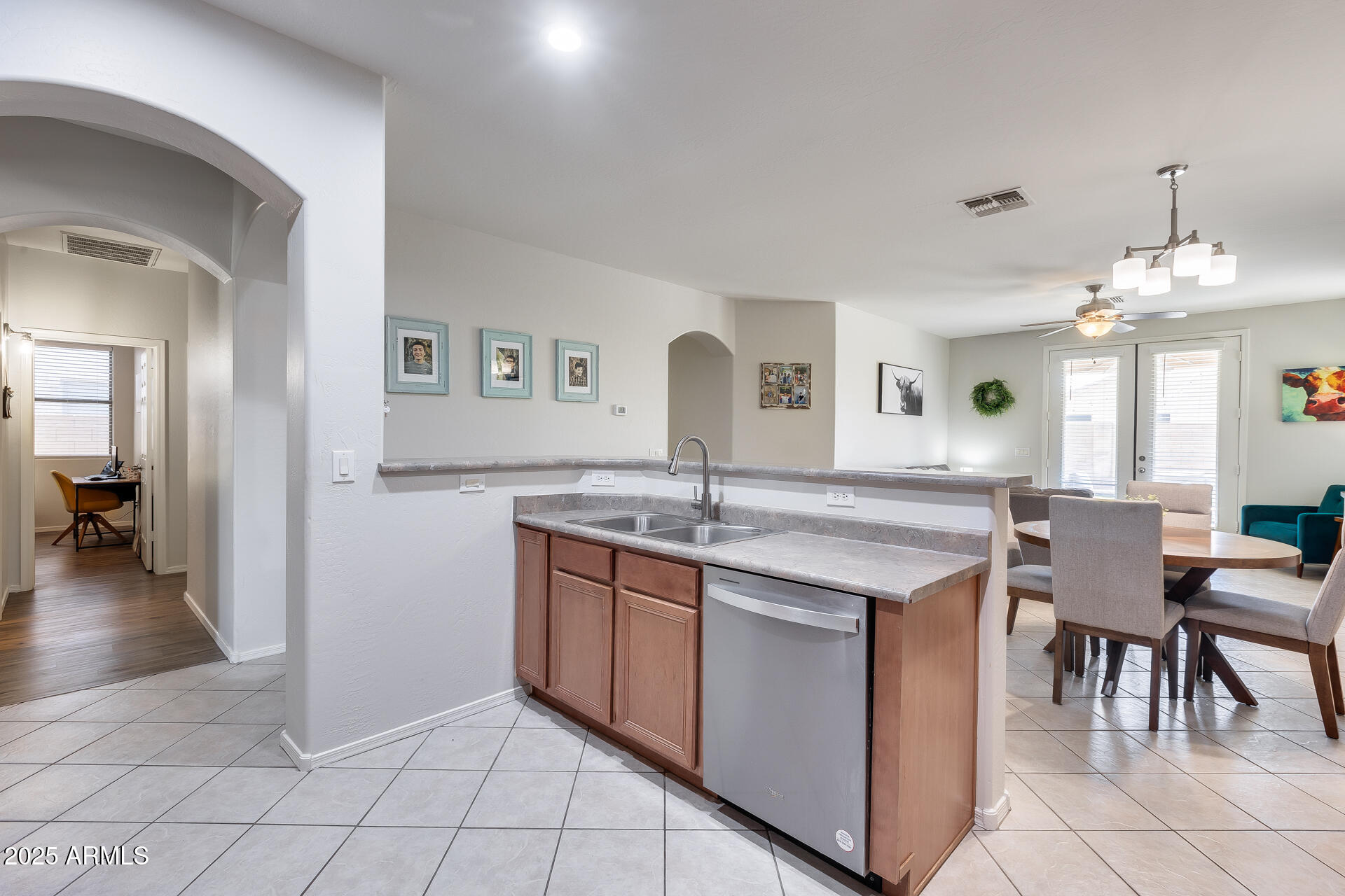 14229 West Calavar Road Surprise, AZ 85379 - Photo 13 of 44 a kitchen with granite countertop a sink and cabinets