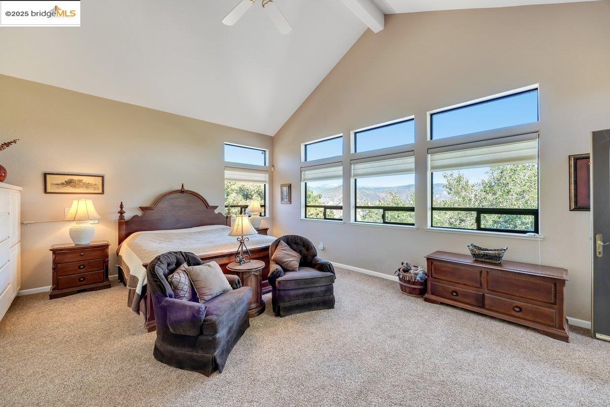 13700 Clements Road Groveland, CA 95321 - Photo 28 of 93 Bedroom with high vaulted ceiling, beamed ceiling, light carpet, and ceiling fan