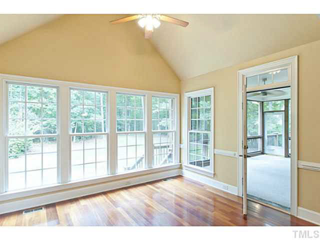 CHEERFUL breakfast room with easy access to SCREENED PORCH overlooks SERENE and LEVEL backyard. Breakfast Area