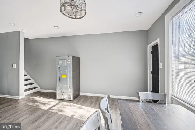 a view of a livingroom with furniture and a window