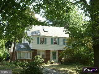 523 Ashmead Road Cheltenham, PA 19012 - Photo 1 of 1 a front view of a house with a garden