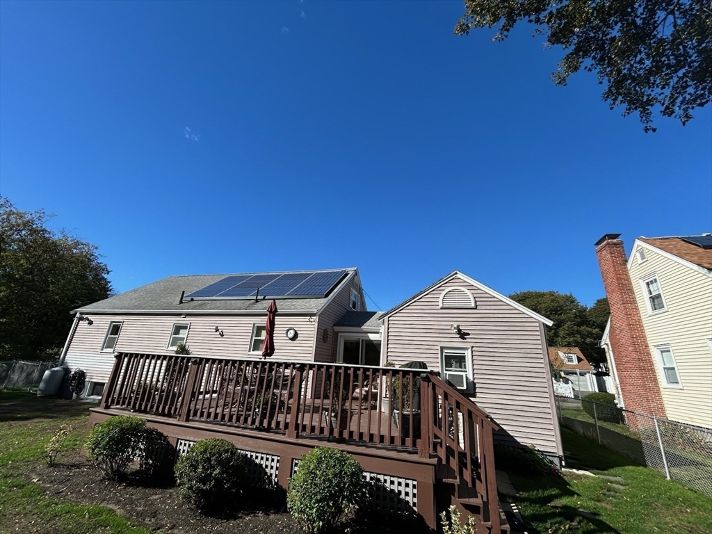 28 Emory Street Saugus, MA 01906 - Photo 13 of 34 a view of a roof deck with wooden fence and plants