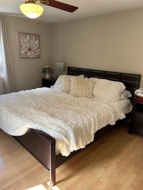 28 Emory Street Saugus, MA 01906 - Photo 18 of 34 a bedroom with a bed and lamp