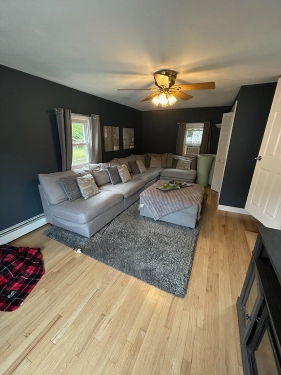 28 Emory Street Saugus, MA 01906 - Photo 23 of 34 a living room with furniture and a fireplace