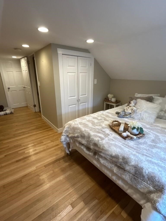 28 Emory Street Saugus, MA 01906 - Photo 27 of 34 a bedroom with a bed and a view of en suite bathroom