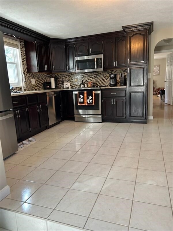 28 Emory Street Saugus, MA 01906 - Photo 29 of 34 a large kitchen with cabinets and stainless steel appliances