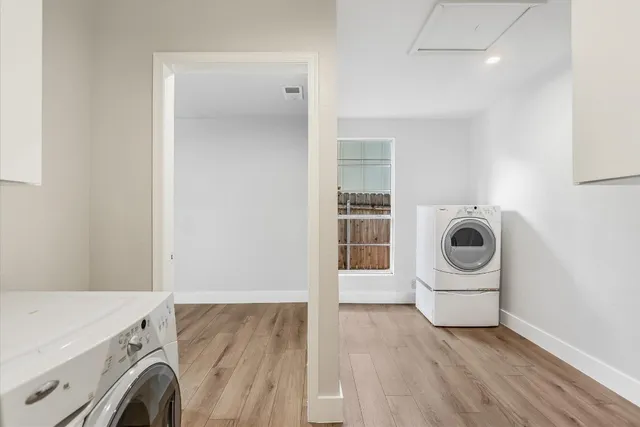 a view of a storage & utility room with washer and dryer