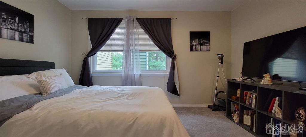 117 Shady Court Evesham, NJ 08053 - Photo 13 of 14 a bedroom with a bed and a flat tv screen