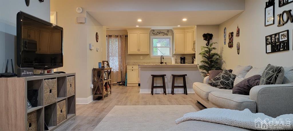 117 Shady Court Evesham, NJ 08053 - Photo 3 of 14 a living room with furniture a flat screen tv and a fireplace