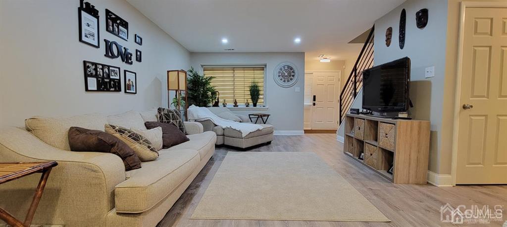117 Shady Court Evesham, NJ 08053 - Photo 4 of 14 a living room with furniture and a flat screen tv