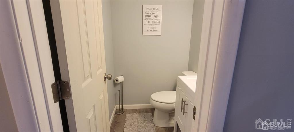 117 Shady Court Evesham, NJ 08053 - Photo 7 of 14 a white toilet sitting next to a shower