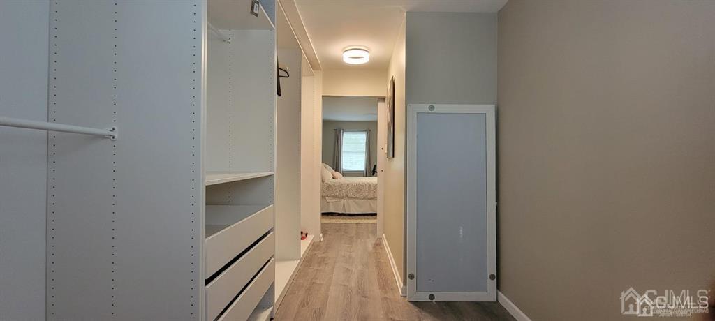117 Shady Court Evesham, NJ 08053 - Photo 9 of 14 a view of a hallway with wooden floor and staircase