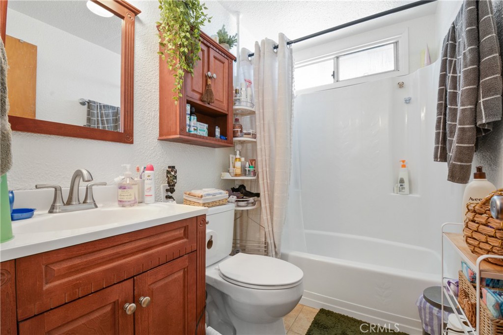 410 South Orange Avenue, Unit B Brea, CA 92821 - Photo 6 of 7 a bathroom with a sink toilet and shower