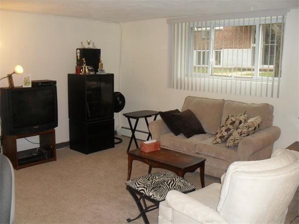 12 Bryon Road, Unit 1 Chestnut Hill, MA 02467 - Photo 3 of 8 a living room with furniture and a flat screen tv