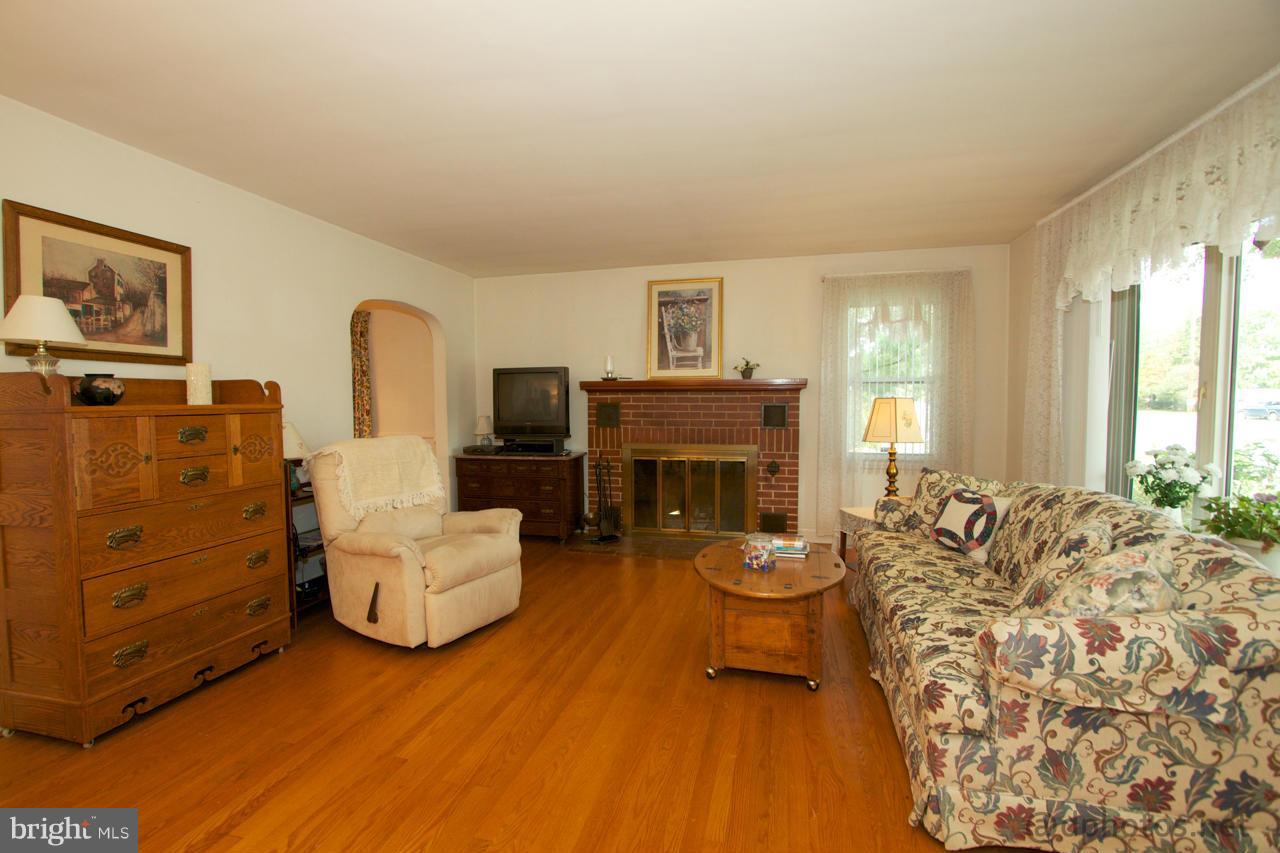 24 Mountain Road Fallston, MD 21047 - Photo 3 of 19 a living room with furniture and a fireplace