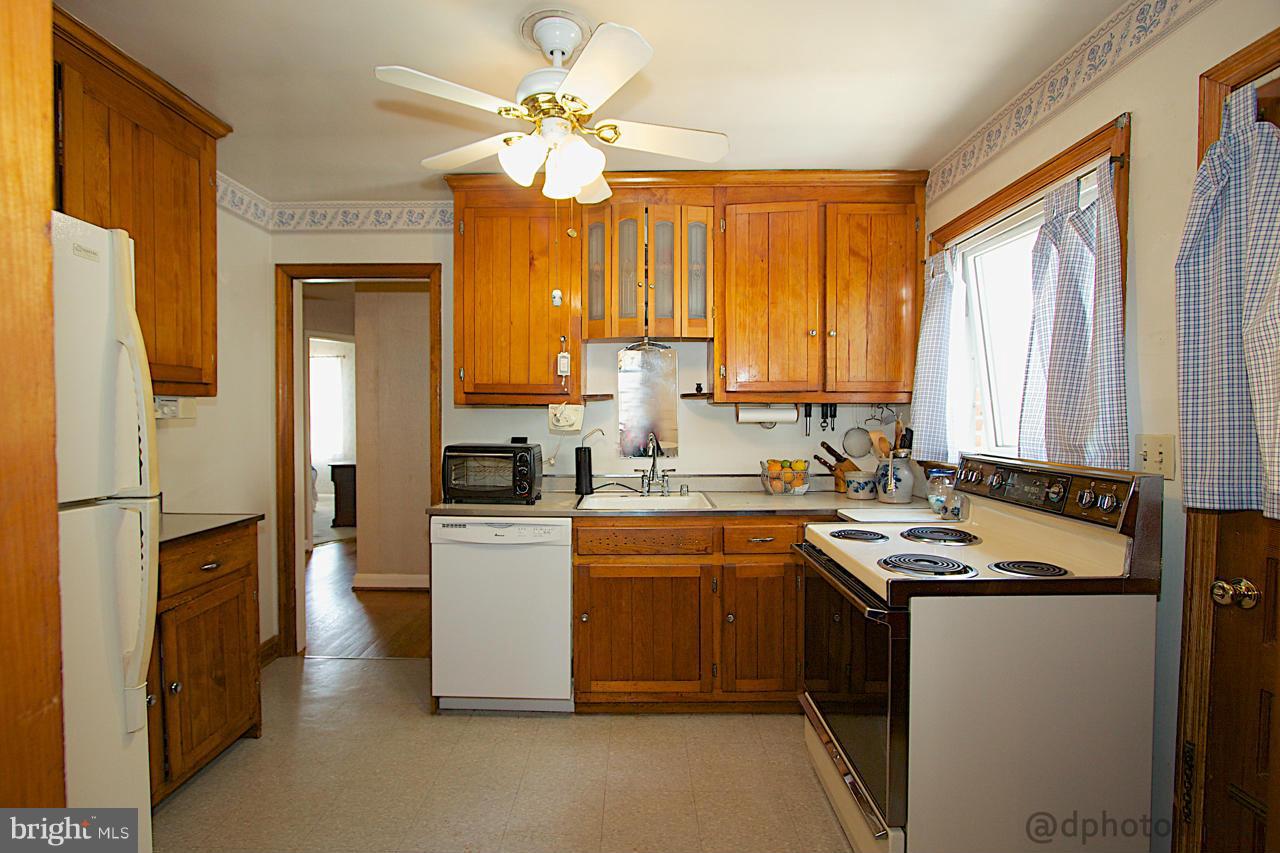 24 Mountain Road Fallston, MD 21047 - Photo 8 of 19 a kitchen with a sink stove and refrigerator
