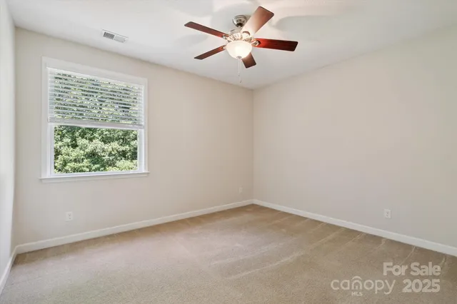 a view of a hallway with windows