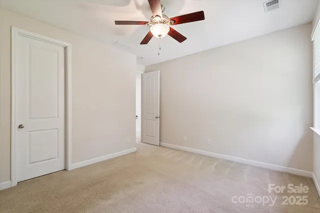 a bathroom with a sink toilet vanity and shower