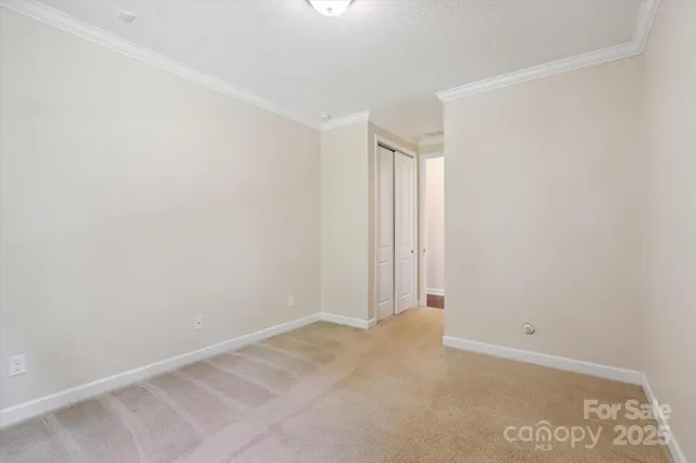 a view of a house with a floor to ceiling window and wooden floor