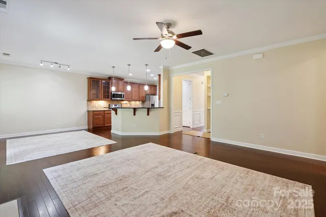 a view of a kitchen with a sink and a refrigerator