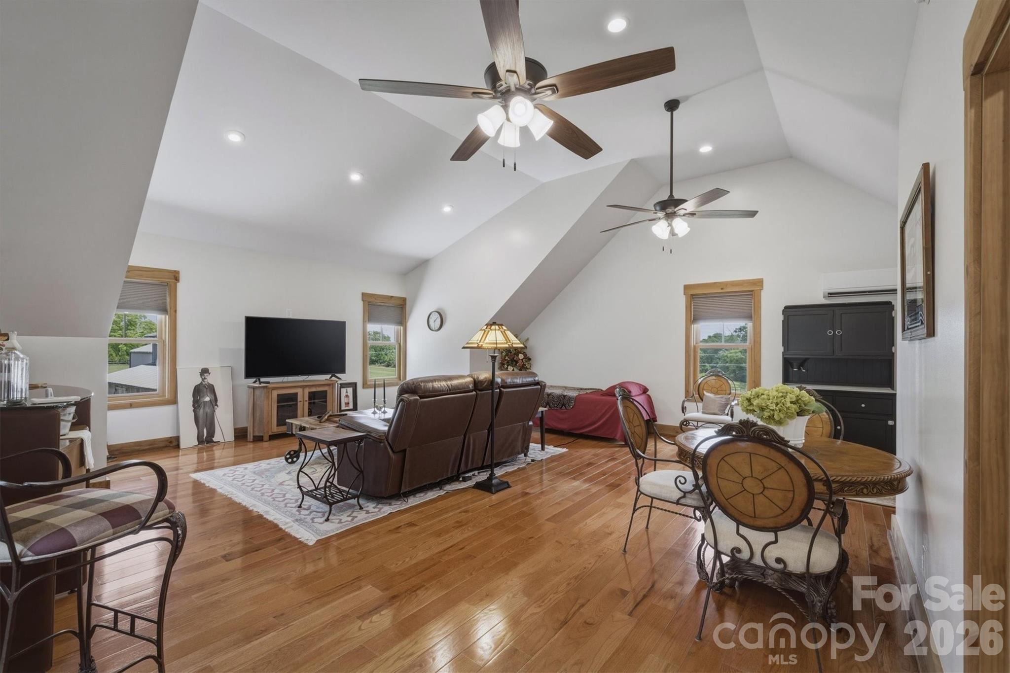7490 Oak Ridge Church Road Connelly Springs, NC 28612 - Photo 29 of 44 a living room with furniture a flat screen tv and kitchen view