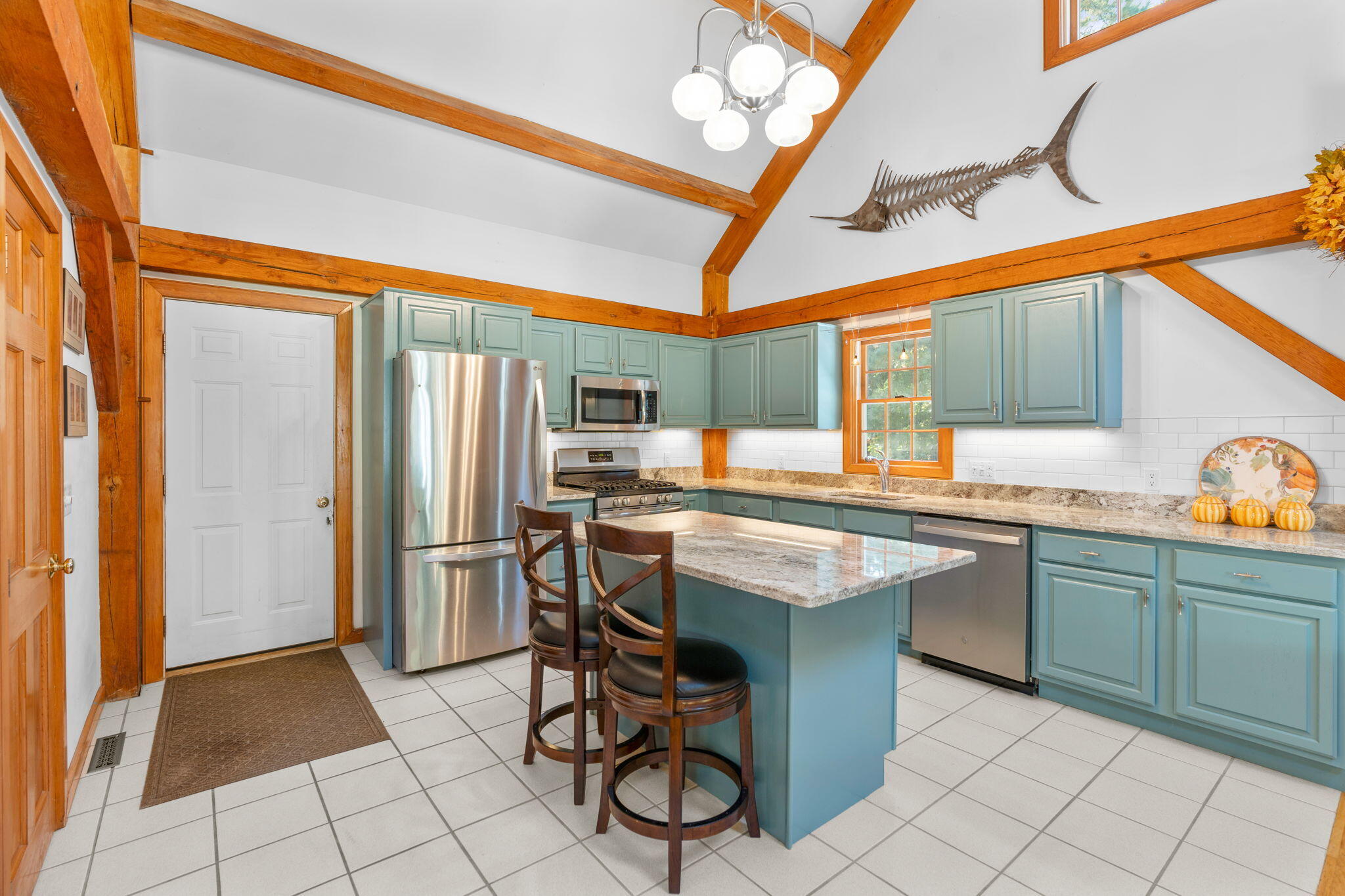 718 Cedar Street West Barnstable, MA 02668 - Photo 21 of 40 a kitchen with stainless steel appliances granite countertop a sink and a refrigerator