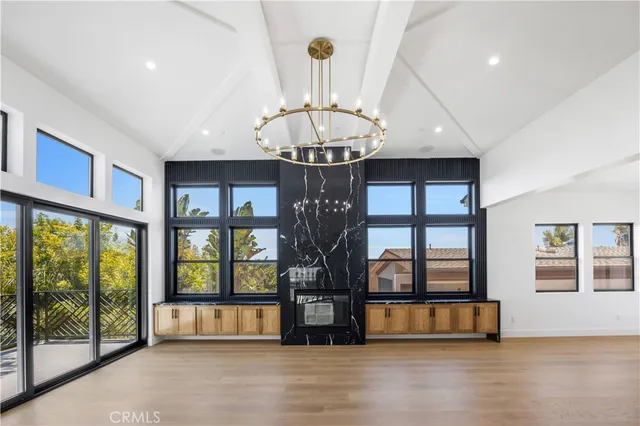 a large kitchen with stainless steel appliances kitchen island granite countertop a large center island in the center