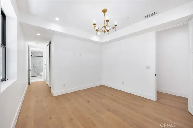 a view of an empty room with a fireplace