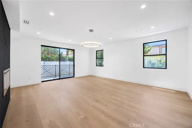 a bathroom with a granite countertop sink a mirror and vanity