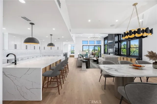 a bedroom with a large bed and a painting on the wall