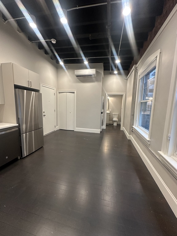 281 Franklin Street, Unit 602 Boston, MA 02110 - Photo 3 of 10 a view of empty room with wooden floor