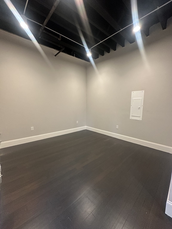 281 Franklin Street, Unit 602 Boston, MA 02110 - Photo 6 of 10 a view of a room with wooden floor and windows