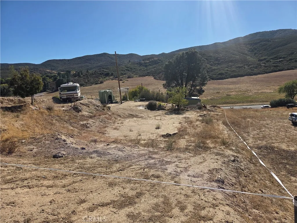 0 Deer Bank Road Lake Elizabeth, CA 93532 - Photo 2 of 2 a view of a dry yard with mountains in the background