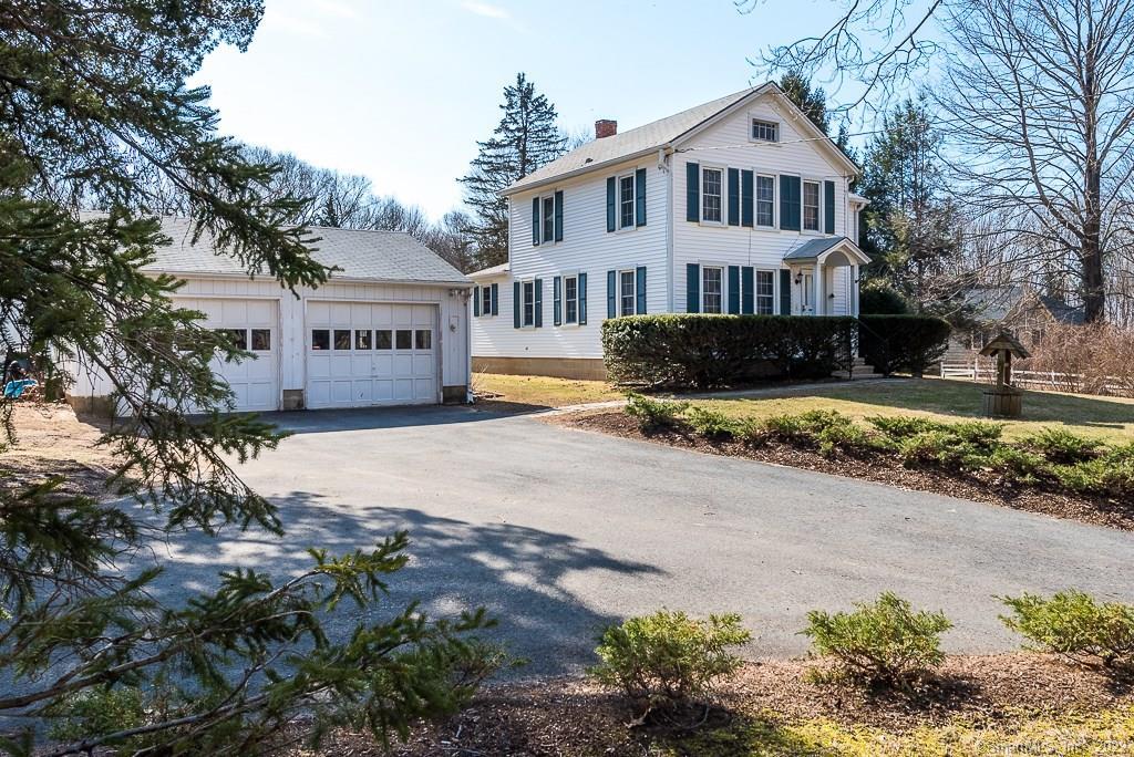 358 Green Hill Road Madison, CT 06443 - Photo 1 of 1 a house that has a tree in front of it