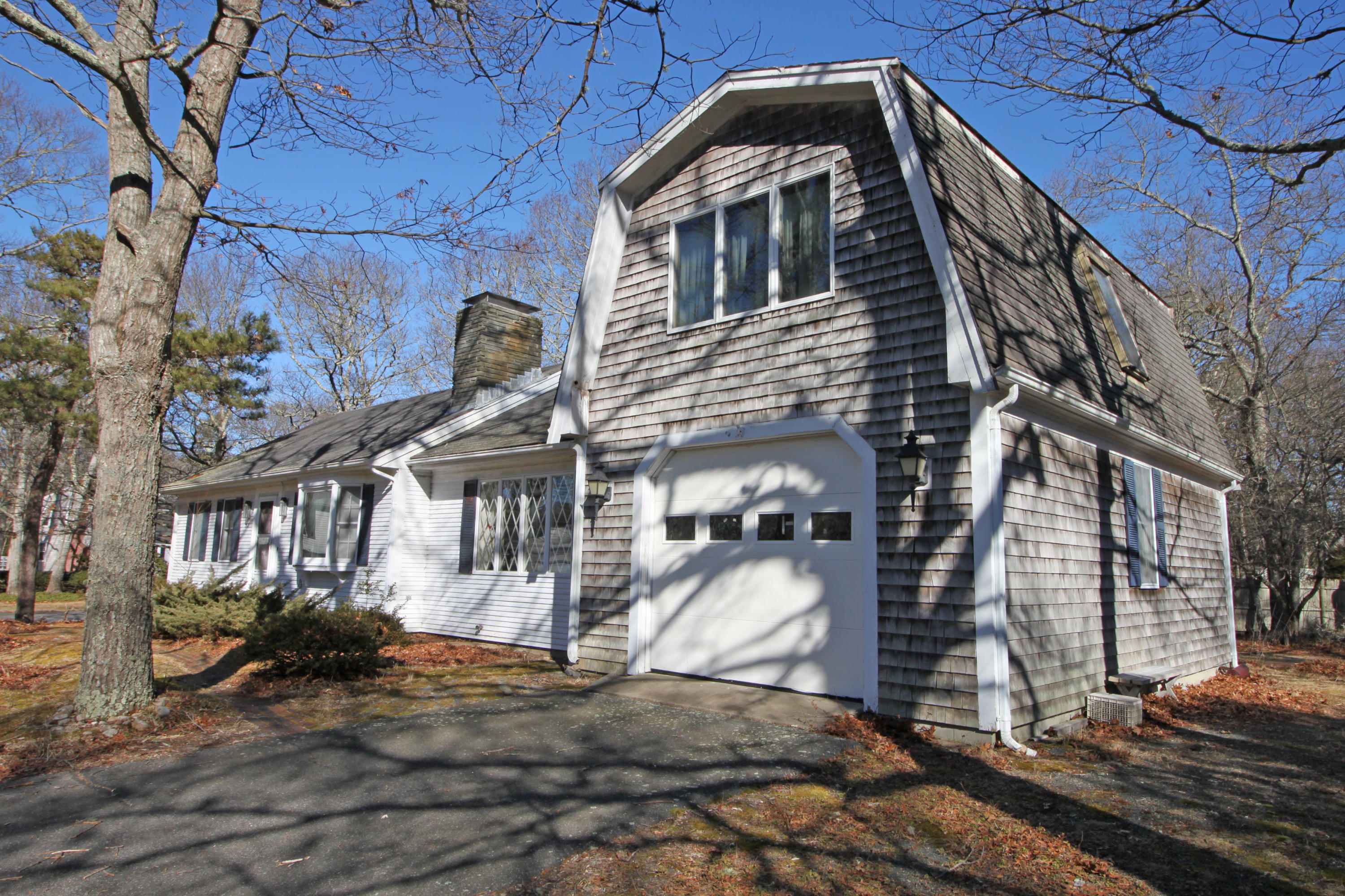 52 Moon Penny Lane Centerville, MA 02632 - Photo 2 of 12 a front view of a house