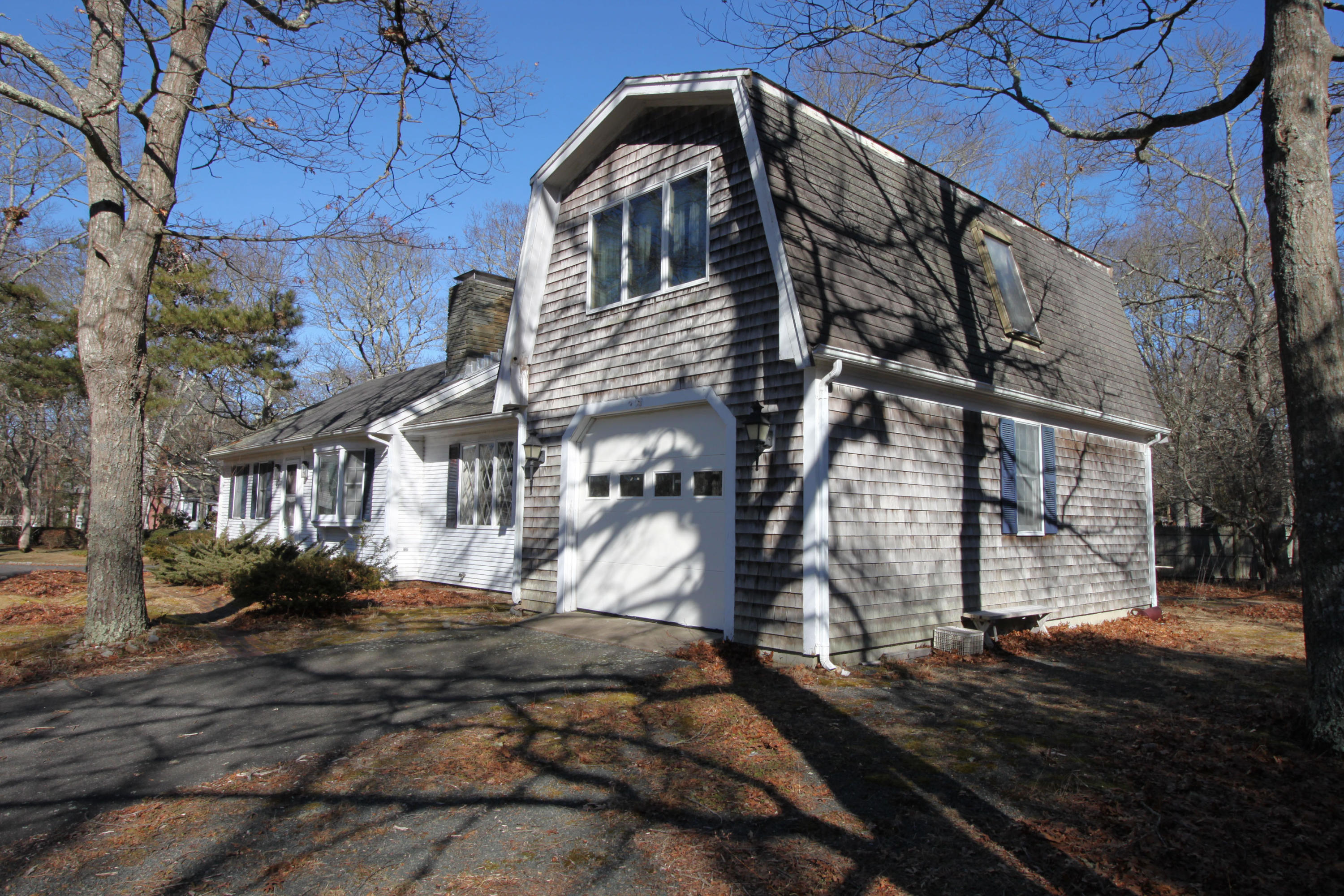 52 Moon Penny Lane Centerville, MA 02632 - Photo 5 of 12 a view of a house with a yard