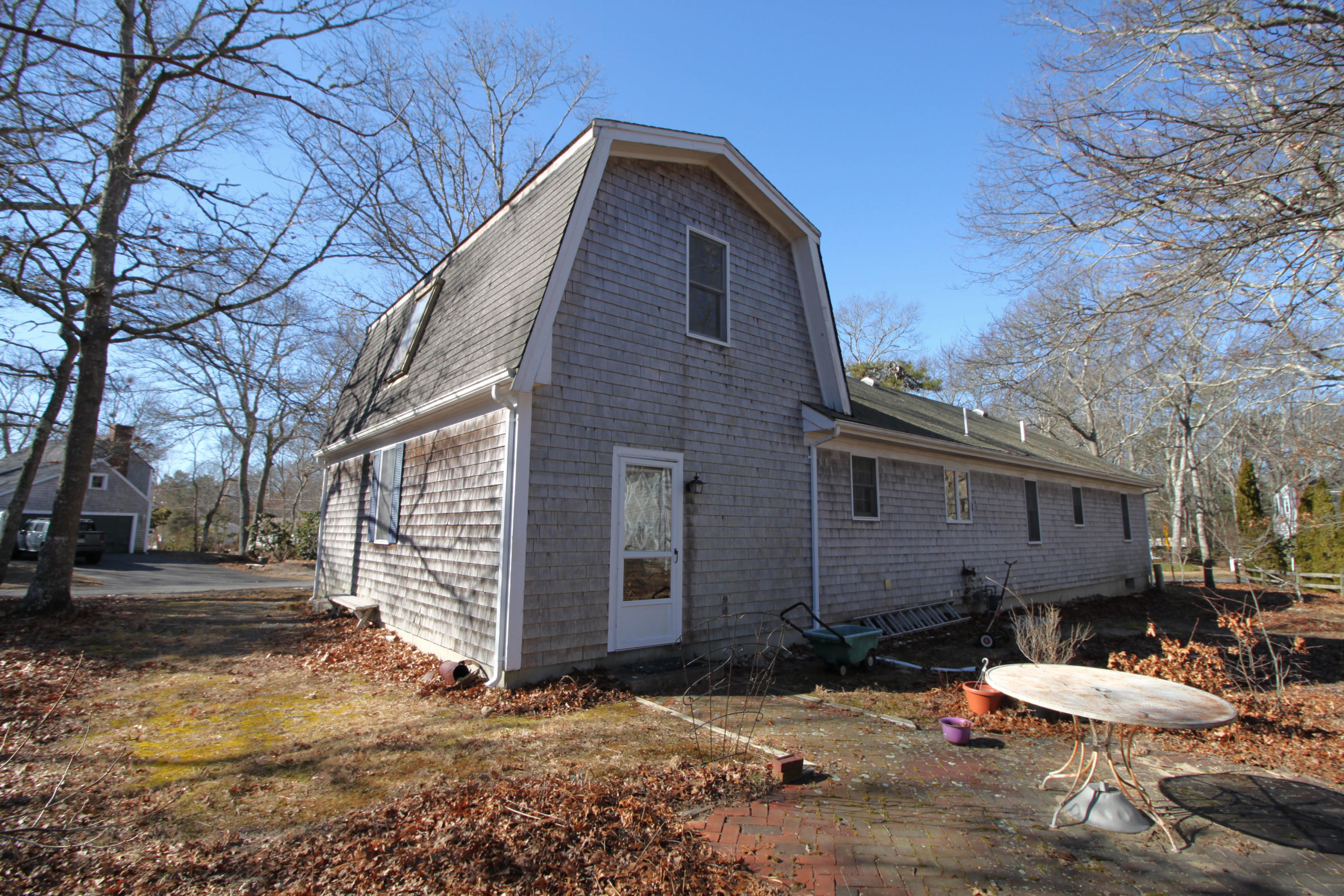 52 Moon Penny Lane Centerville, MA 02632 - Photo 7 of 12 a view of a house with a yard