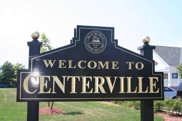 52 Moon Penny Lane Centerville, MA 02632 - Photo 10 of 12 a street sign that is on a pole