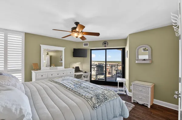 a bedroom with a bed a window and dresser