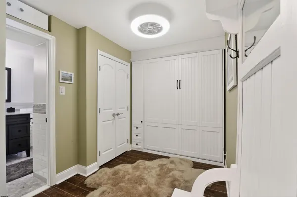 a view of a room with wooden floor
