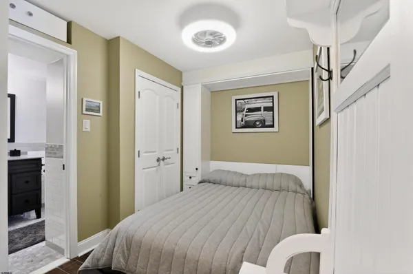 a bedroom with a bed and a walk in closet