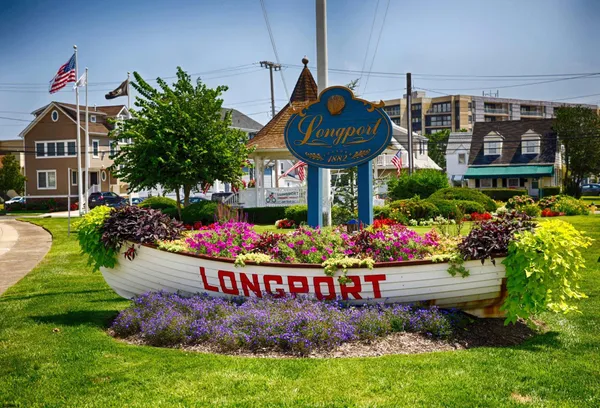 a sign that is in front of flowers