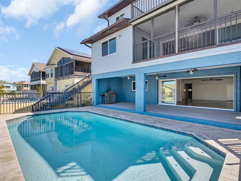 6241 Bayside Drive New Port Richey, FL 34652 - Photo 3 of 78 a view of a house with pool and chairs