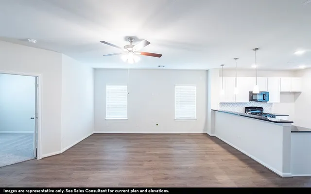 a view of kitchen with wooden floor