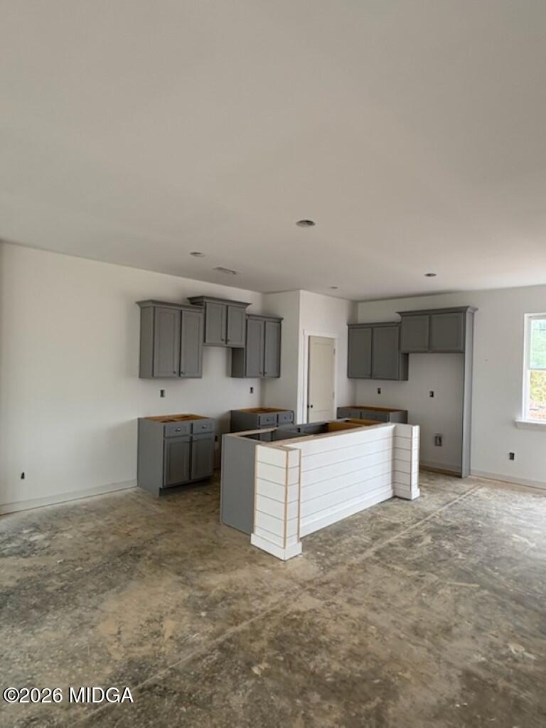127 Bramblewood Lane Perry, GA 31069 - Photo 3 of 32 a kitchen with stainless steel appliances a sink a stove and cabinets