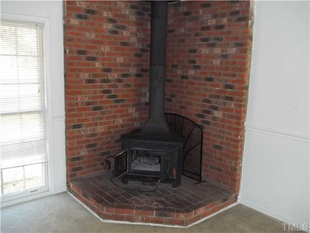 801 New Rand Road Garner, NC 27529 - Photo 6 of 9 Wood burning stove in living room