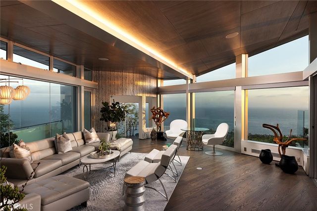 a lobby with furniture and a glass door