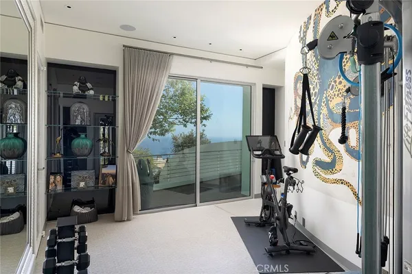 a view of a house with backyard porch and sitting area